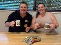 Amanda Turner shares a batch of ANZAC biscuits with Mt Isa RSL president Troy Hartas, a 20 year veteran who served in the Royal Australian Navy and retired a petty officer systems supervisor operator. Picture: Supplied