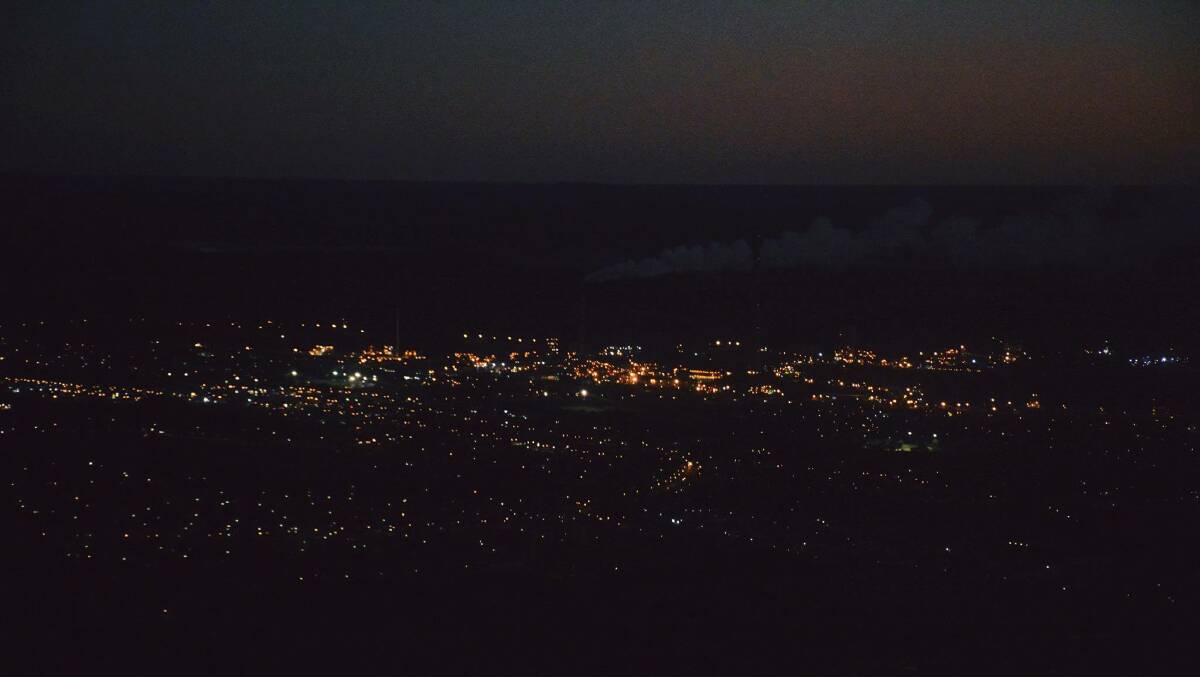 DESCENDING: A photograph of Mount Isa at night taken from a charter plane seat. Photo: Chris Burns. 