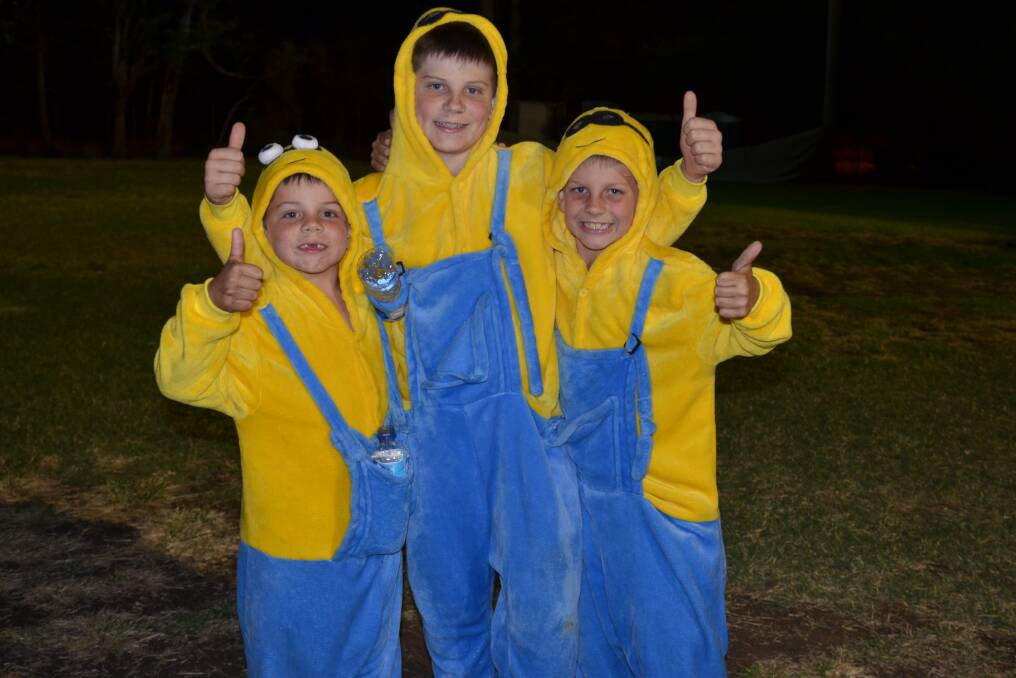 Minions Tyler McAuliffe, 6, Brayden McAuliffe, 10, and Bailey McAuliffe, 7, are allowed to stay up as late as they want so they can walk in Relay for Life.