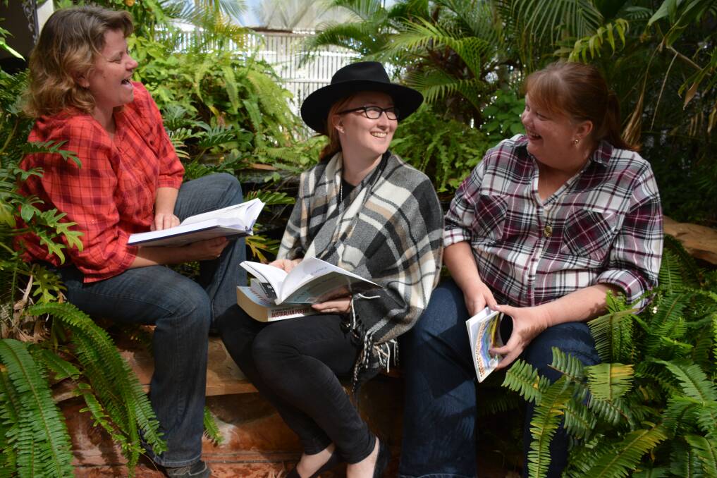 POETRY READING: Mount Isa Zonta Club members Lyn White, Kate Glover and Liza Dowler promote a bush poetry breakfast to be held during the Mount Isa Rotary Rodeo week. Photo: Chris Burns. 