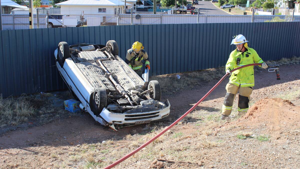 Emergency services attend the car rollover on August 9. Photo: Samantha Walton. 