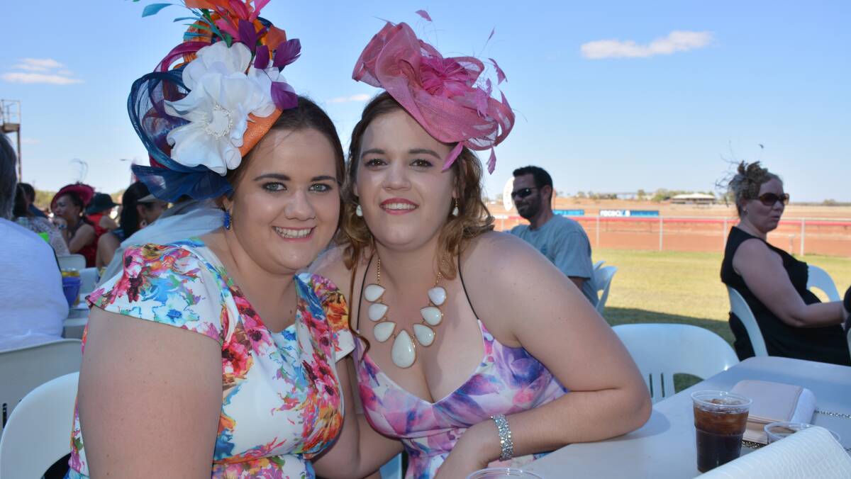 Terri Paine and Chloe Brunker, both from Cloncurry, get dolled up for the races last Saturday.