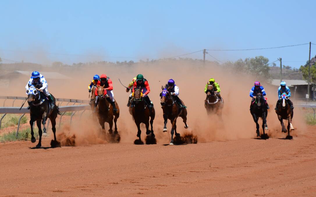 The racehorses make the turn in the 1000 metre Maiden Plate, the first race of the day at Schumacher Park. Photo: Chris Burns. 