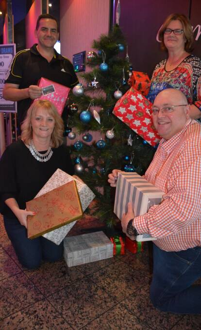 Gifts: Boss Shop managing director Travis Crowther, Ruswin sales manager Wendy Williams, Commerce North West's Sue Wicks, Airside Logistics owner Gary Murray.