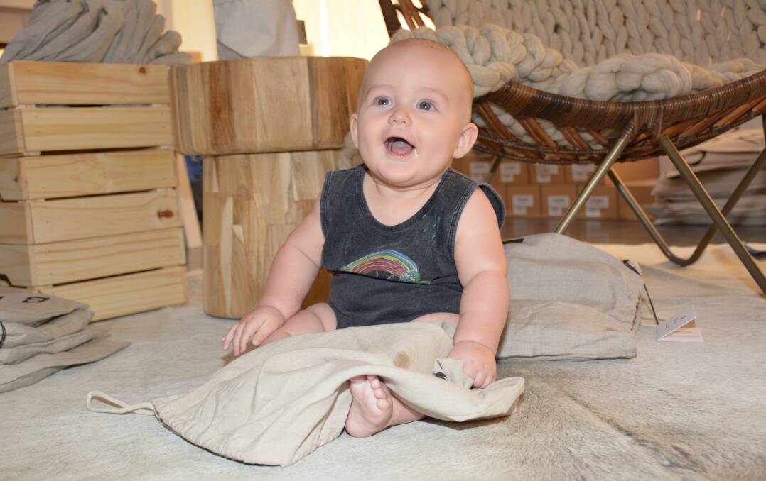 FASHION MODEL: Jack Stanley, six months, wears a Children of the Tribe onesie in the store Desert Luxe. Photo: Chris Burns. 