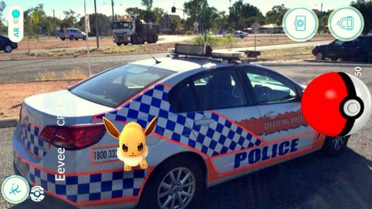 AVOIDING ARREST: Sergeant Cath Purcell attempts to capture the Pokemon 'Eevee.' 