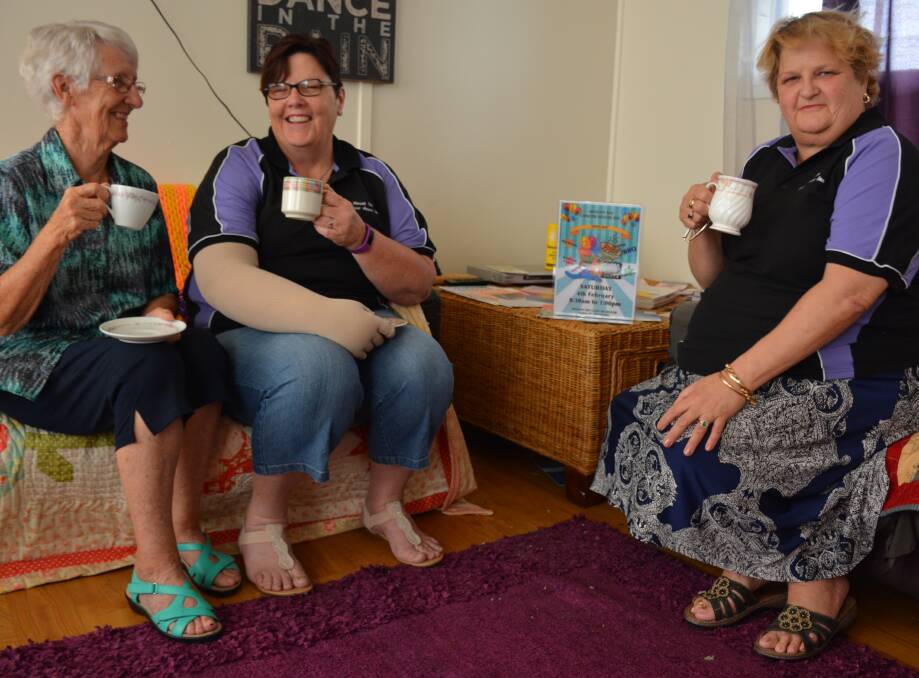 SAFE SPACE: Cancer House committee members Yvonne McCoy, Trish Olsen and Linda Lawrenson enjoy a chat and coffee. Photo: Chris Burns. 