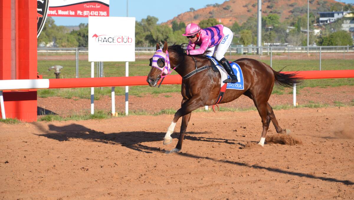 Golden Meteor and Louise Dillon pass the post during the Mount Isa Spring Cup. Photo: Chris Burns. 