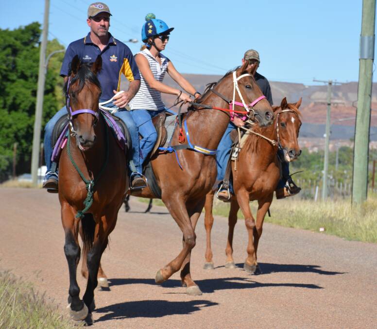 MORNING RIDE: Local jockey Aaron Spradau and Josie Crawford ride to the soccer grounds to be part of the trail ride in memory of Christine Hann. Photo: Chris Burns. 