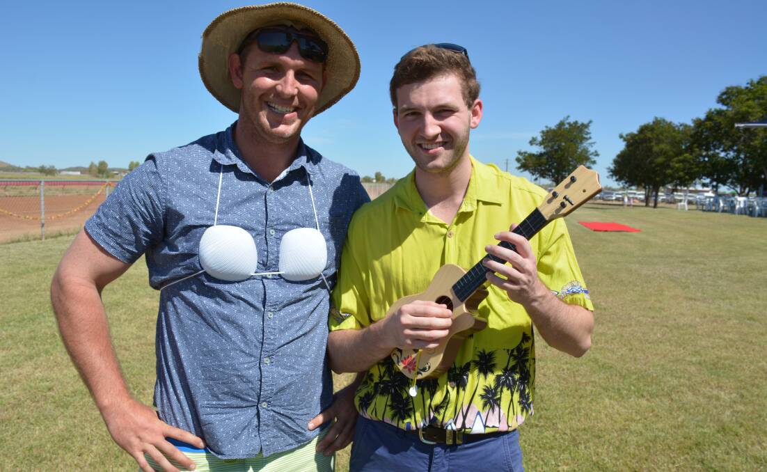 SWEET SERENADE: Tim McClymont and Drew Alexion enjoyed last year's Cloncurry Luau Races. Mr McClymont won the novelty prize. Photo: Chris Burns. 