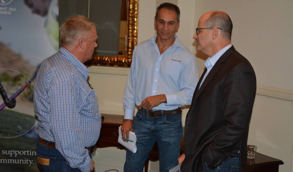 PRIVATE DISCUSSION: MITEZ president David Glasson speaks with Glencore executives Mike Westerman and Greg Ashe at the Mount Isa Mines' community consultation meeting. Photo: Chris Burns. 