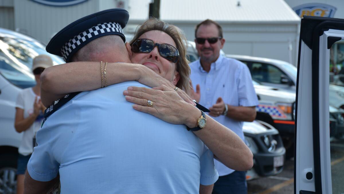 Lyn Kidd hugs her husband, outgoing Inspector Trevor Kidd. 