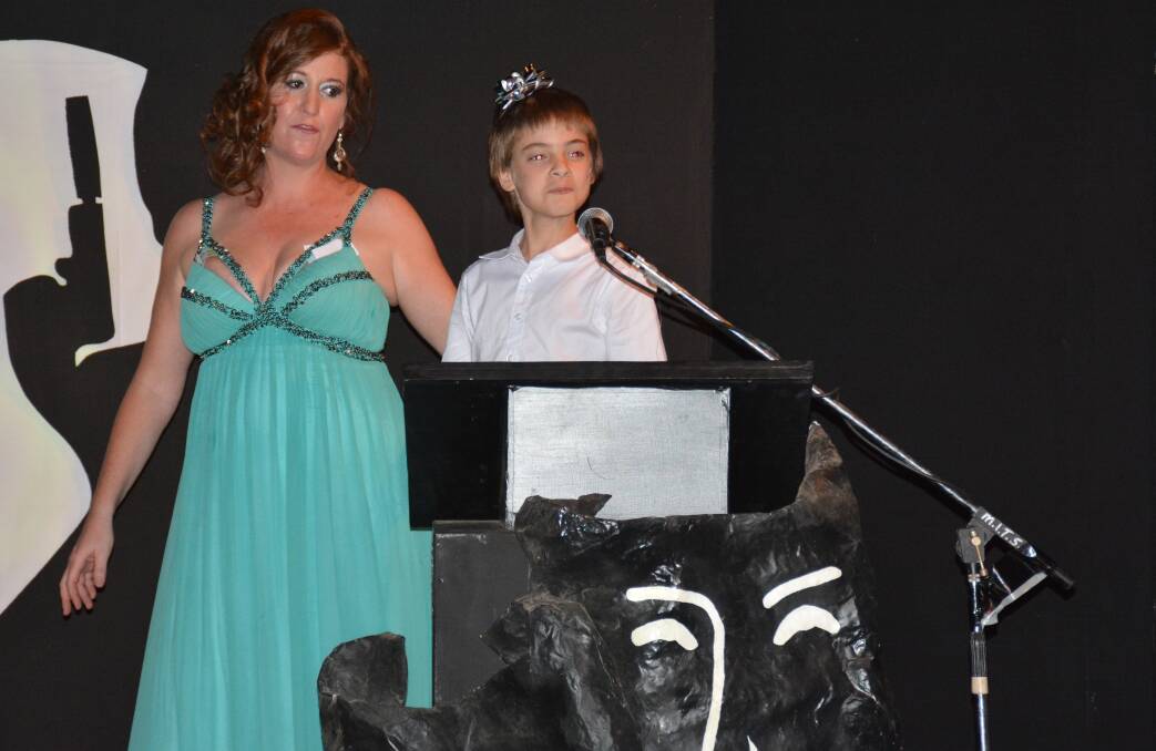 Mount Isa Theatrical Society's publicity officer Jenelle Robartson and best junior newcomer Connor Heuir at the 2016 MITSIES awards night. Photo: Chris Burns.