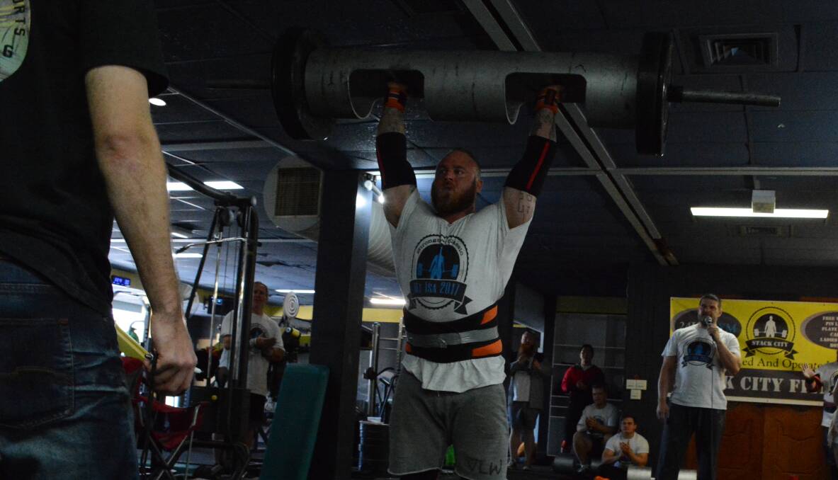 HEAVY WEIGHT: Cairns man Lee Anderson lifts 122 kilograms while competing in Strongman. Photo: Chris Burns. 
