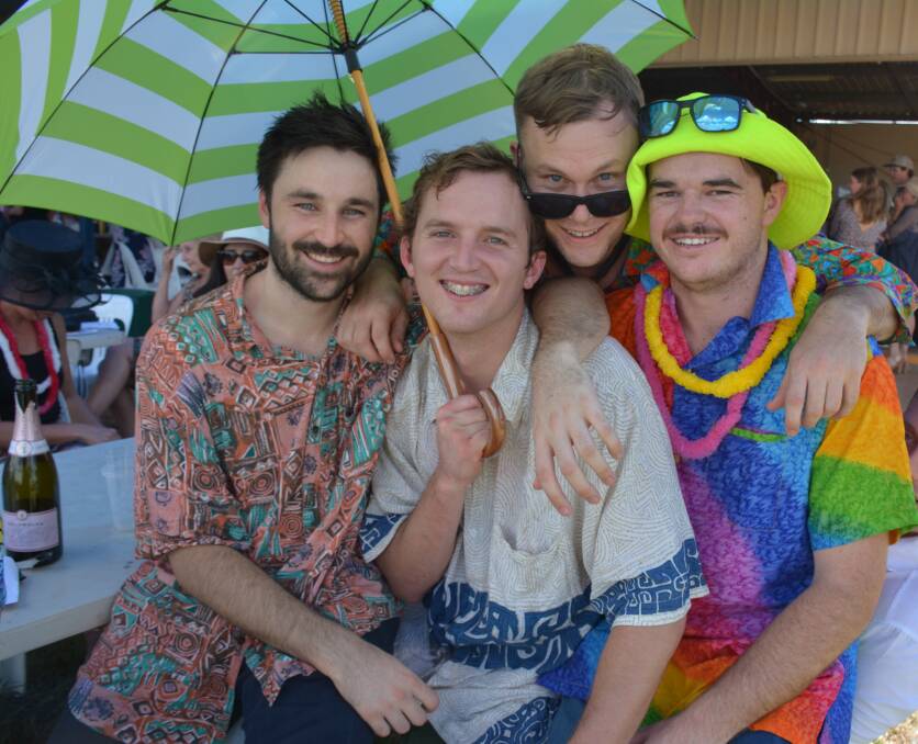 BEACH PARTY RACES: Harry Mounsey (centre) enjoys the Cloncurry Luau Races with William Allen, Joe Blennerhassert, and Dan Tucker, held on Saturday. Photo: Chris Burns. 