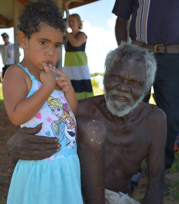 FAMILY PHOTO: Lardil elder Cyril Moon has a photograph taken with his great granddaughter. Mr Moon welcomed visitors to country at the project opening. 