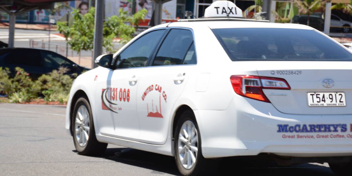A taxi drives in Rodeo Drive in the Mount Isa central business district. 