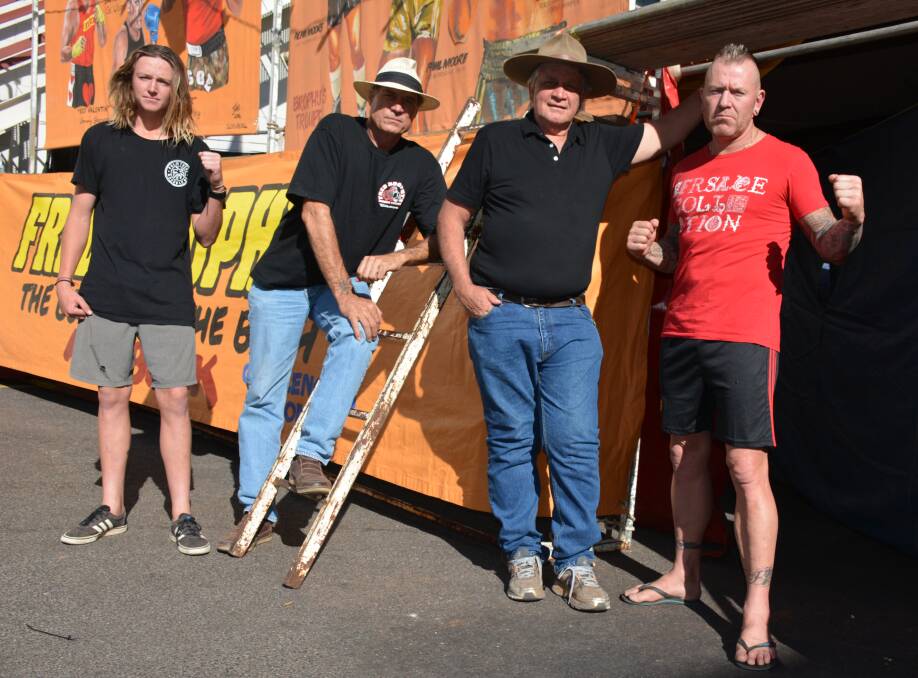READY TO PUT ON A SHOW: Mangrove Jack, The Friendly Mauler, Fred Brophy and Kojak stand outside the tent built next to the Isa Hotel. Photo: Chris Burns. 