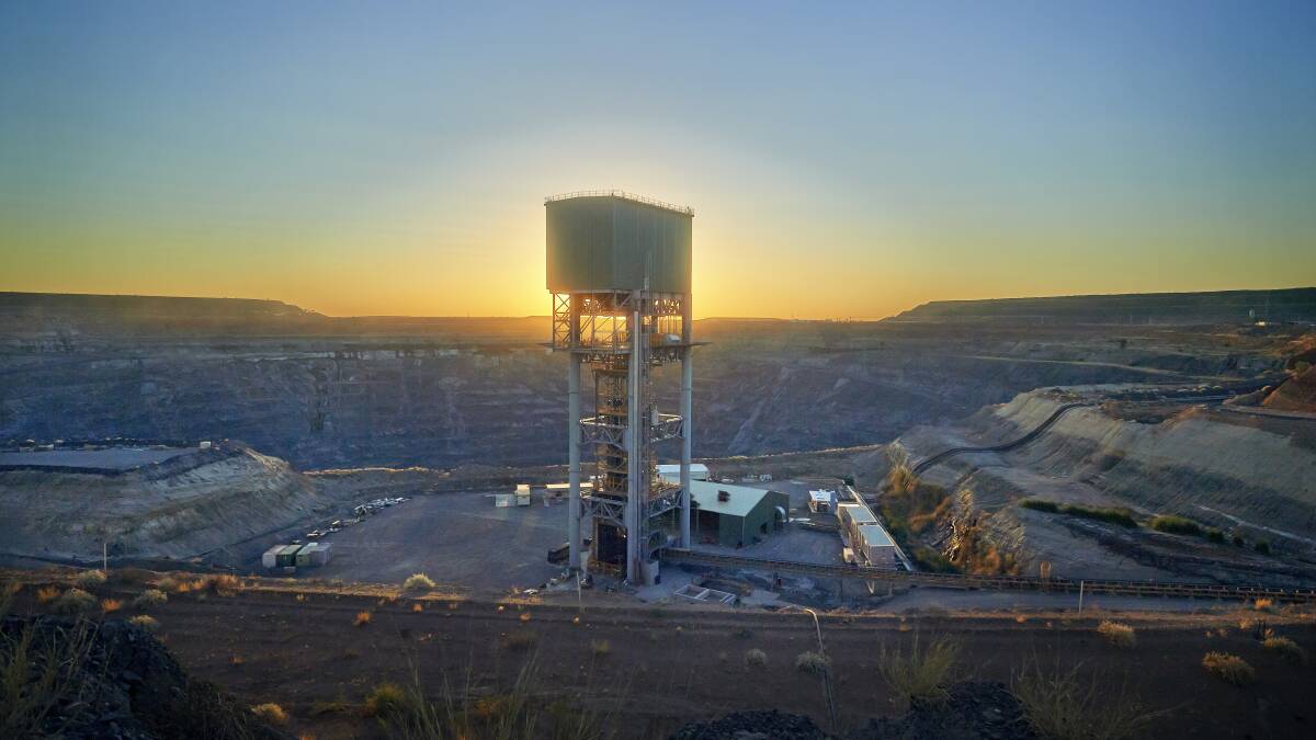 The shaft headframe alongside the completed open pit mine at Ernest Henry. Photo: Glencore. 