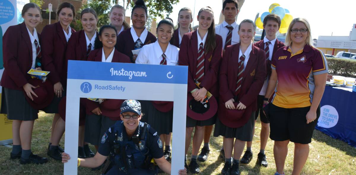 ALL TOGETHER: Constable Michele White, and Good Shepherd Catholic College students and Year 11 pastoral leader show support for Road Safety. 