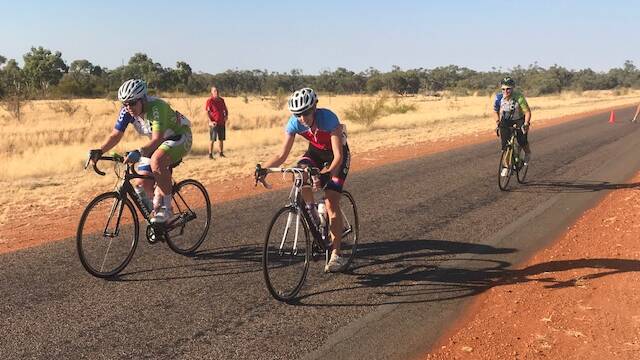 Cyclists ride on Dajarra Road. Photo: Supplied. 