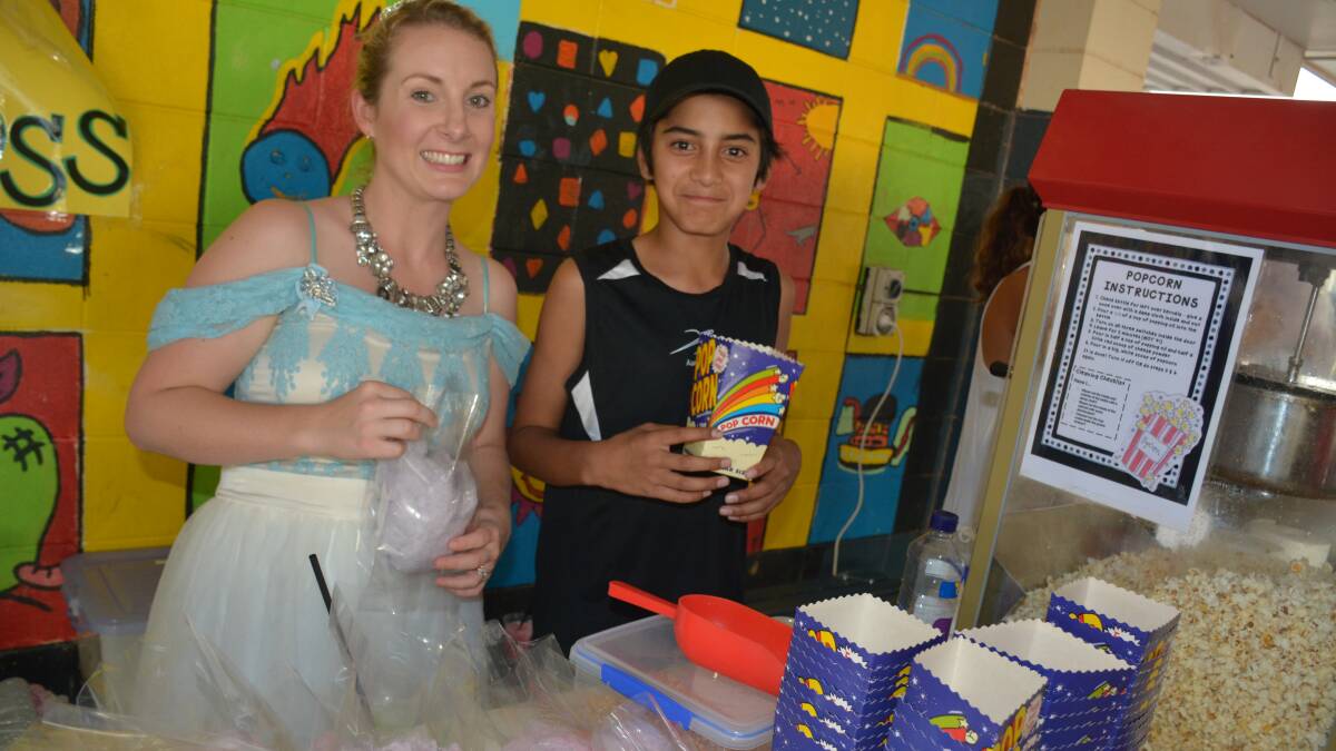 POPCORN STAND: Tania Laffey and Trey Hahipene sell traditional show snacks such as fairy floss and popcorn. 