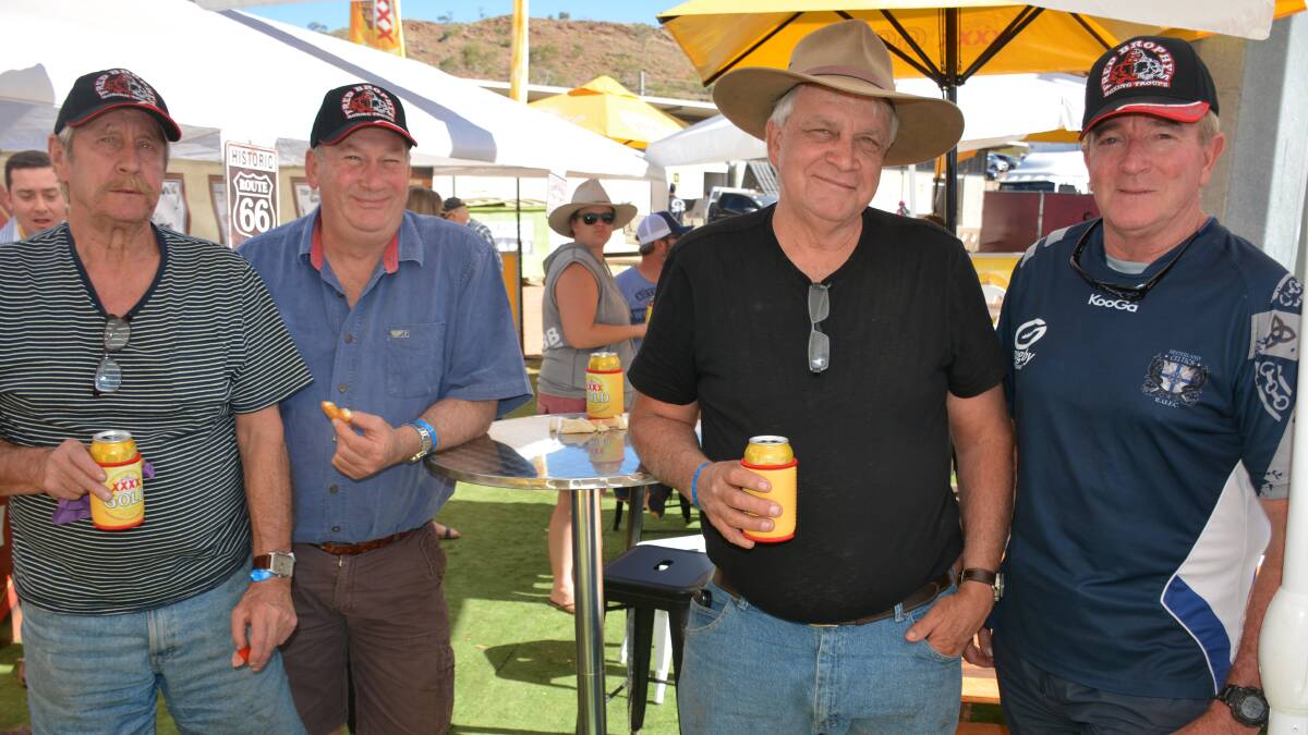 CHILLING WITH MANGOES: Boxing troupe members The Cowboy, The Bagman, Fred Brophy and Rocky relax at the Mount Isa Rotary Rodeo. 