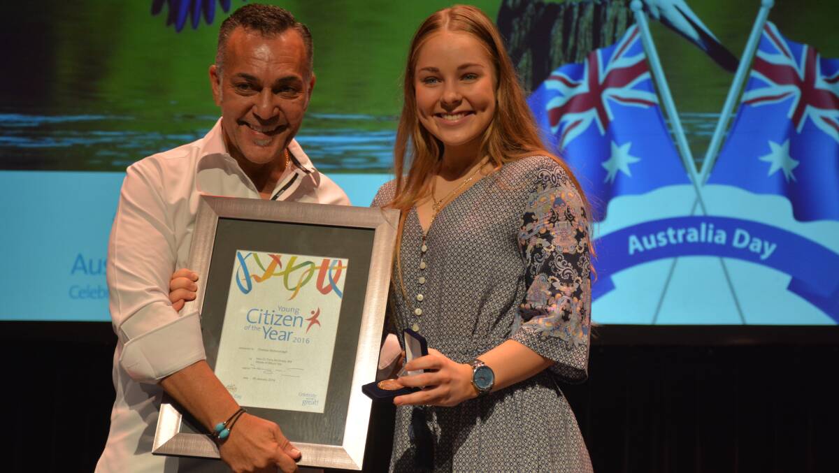 Award ceremony: Australia Day ambassador and Coffee Club director John Lazarou presents the Mount Isa Young Citizen of the Year Award to Chelsea McKavanagh. Photo: Chris Burns. 
