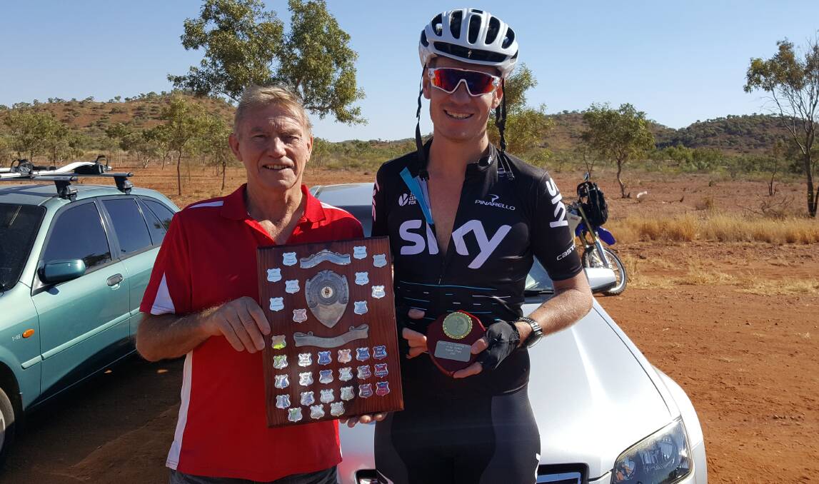 TROPHY PRESENTATION: 2016 winner Tony Sweeney presents the trophy to Matthys Labuschagne, who was the handicap and fastest time winner. Photo: Copper City Cycling Club. 