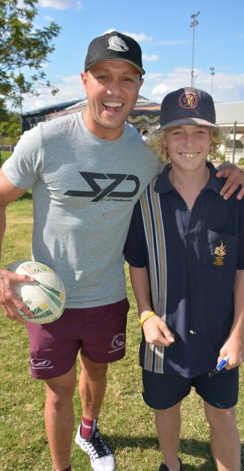 LOCAL PRESENCE: Rugby League legend Scott Prince catches up with Reiley Bishop, 14, on a recent Isa visit. 