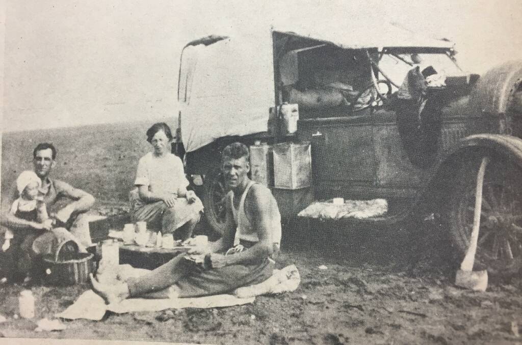 A picnic in the bush? Hardly. Pictured is a group of hardy pioneers heading for the "promised land" of Mount Isa in the late twenties. In those days it was a case of setting up camp by the side of the track to take a welcome break from the tedious overland journey. The old car is loaded up with all the necessities for a new life in the tough North-West. Photo: North West Star archives. 