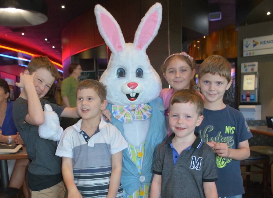SMILES AND HUGS: Jack Laffin, 9, Kyle Laffin, 5, the Easter Bunny, Kaitlin Laffin, 9, Ben Laffin, 4, and David Laffin, 7, have a wonderful Easter. Photo: Chris Burns. 