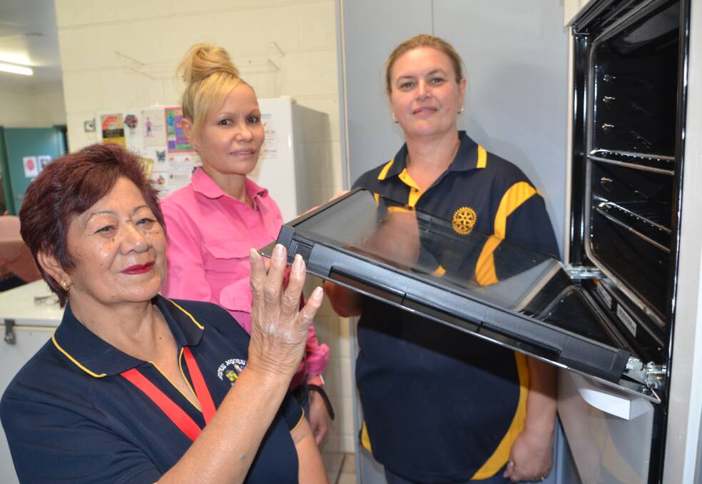 READY TO COOK: Ngurri Ngurri Women's Shelter coordinator Pearl Isaacson, Rotary Club of Mount Isa president Tracy Pertovt, and youth worker Sophie Gunsberger. Photo: Chris Burns. 