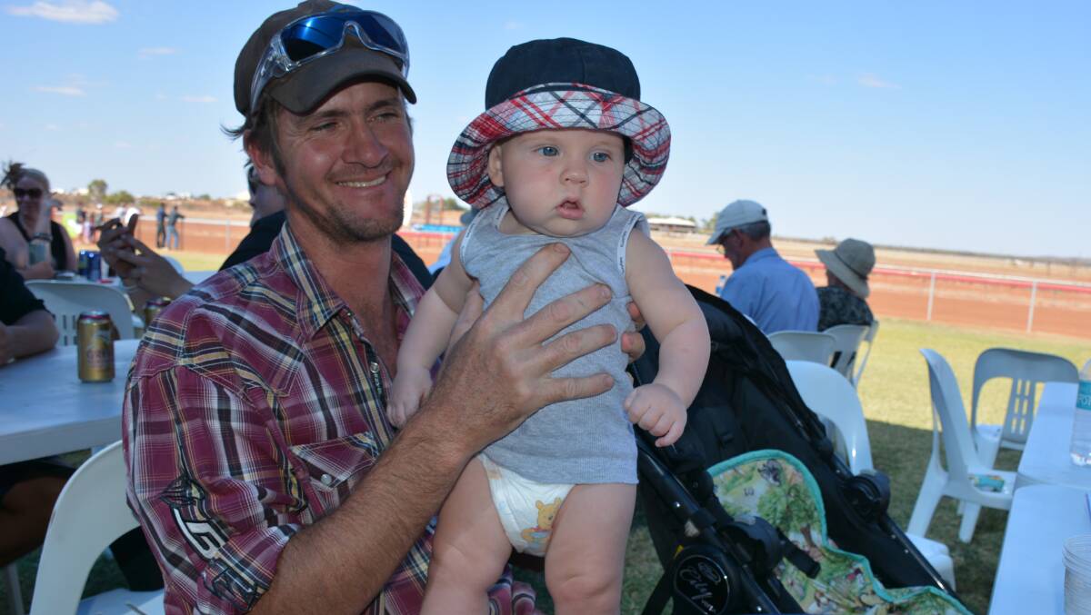 Justin and David Gould, 6 months, from Westmoreland Station, attend the races. It's David's second races he has attended, with his first also in Cloncurry.