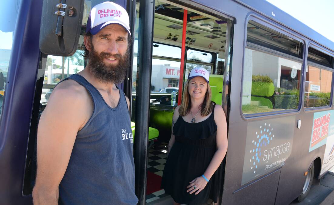 PASSING THROUGH: Darryl Hamm and Belinda Adams drive a purple bus across the country for five weeks for brain injury awareness. 