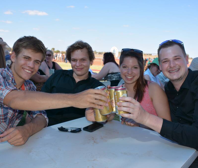 Backpackers have a cheerful day at the Cloncurry Races last Saturday. They are Victor Baasa, Germany, Til Tille, Germany, Lea Puntheller, Germany, and Matthew Harris, Canada.