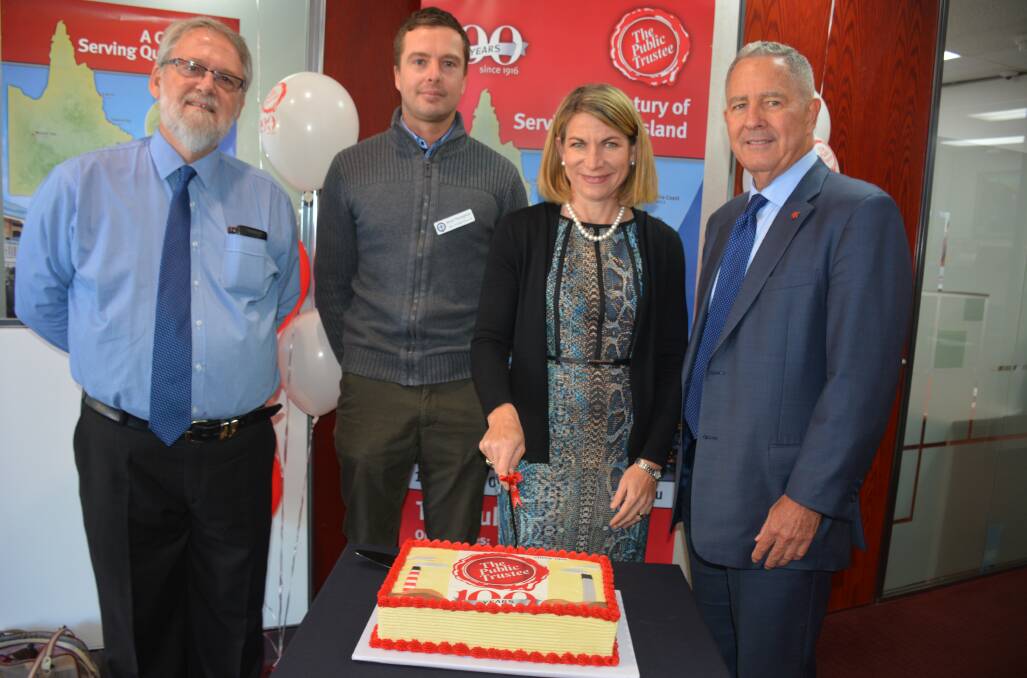 LET THERE BE CAKE: The Public Trustee regional manager Greg Breen, State MP Rob Katter's representative Brad Thompson, Mount Isa Mayor Joyce McCulloch and Public Trustee of Qld CEO Peter Carne celebrate the state government body's centenary. Photo: Chris Burns. 