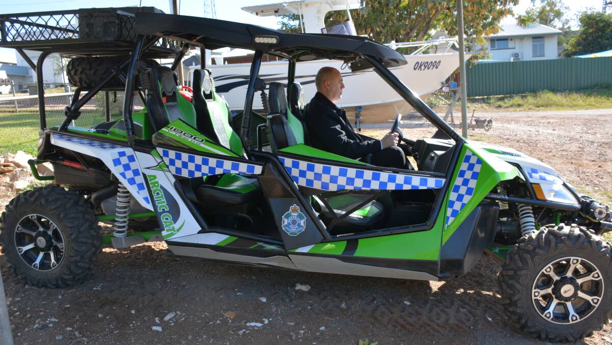 NOT A TOY: Detective-Inspector Chris Hodgman inside the buggy on loan from the Townsville police. If the buggy is for the dried riverbed, then we want to know what the boat is for. Photo: Chris Burns. 