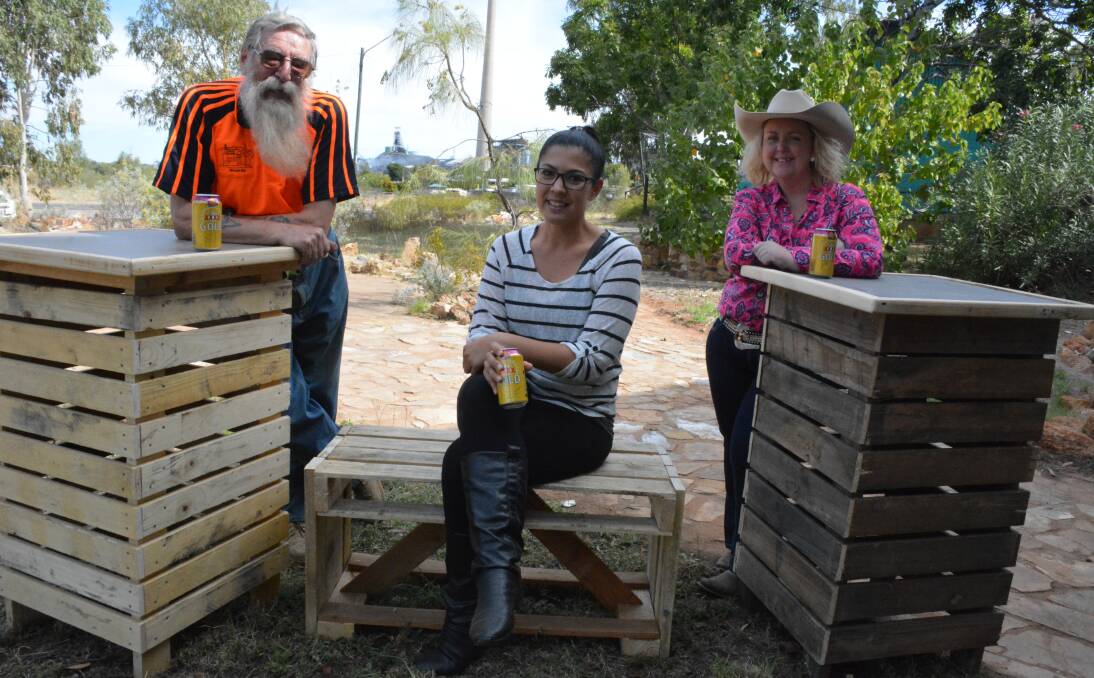 Men's Shed coordinator Richard Lane, Andii Mihay Events stylist Jen Termine-Toth, and Mount Isa Rotary Rodeo manager Natalie Flecker test out the newly constructed dry bars. Photo: Chris Burns. 
