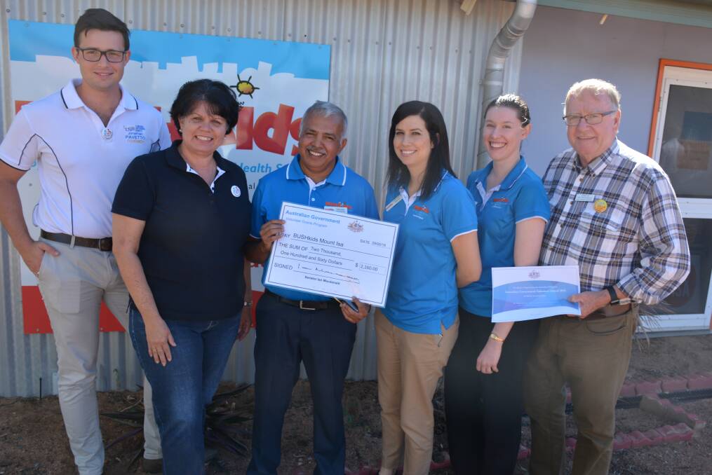 HELPING OUT: The LNP team present BUSHkids with a cheque after a morning tea on Sunday. Pictured are LNP Kennedy candidate Jonathan Pavetto, Senator Joanna Lindgren, BUSHkids staff Carlton Meyn, Lynette Stenhouse, Danica Kelly, and Senator Ian Macdonald. 