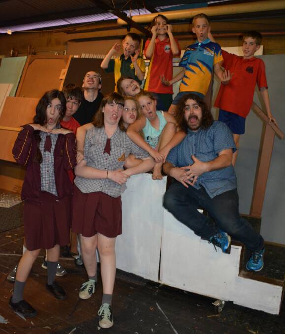 THE NEXT GENERATION: Queensland Theatre Company teacher Troy Dowling shows Mount Isa Theatrical Society's' Harlequin students that it can be fun on stage. Photo: Chris Burns. 