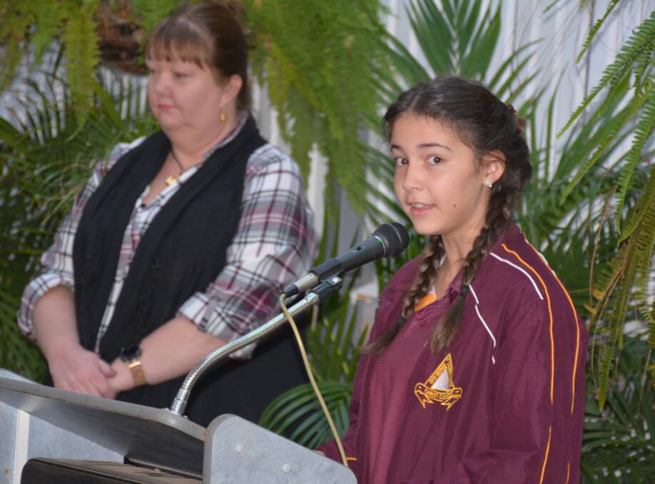 CLEAR SPEAKER: Good Shepherd Catholic College student Isabella Bakhash recites a poem chosen by Mount Isa mayor Joyce McCulloch. Photo: Chris Burns. 