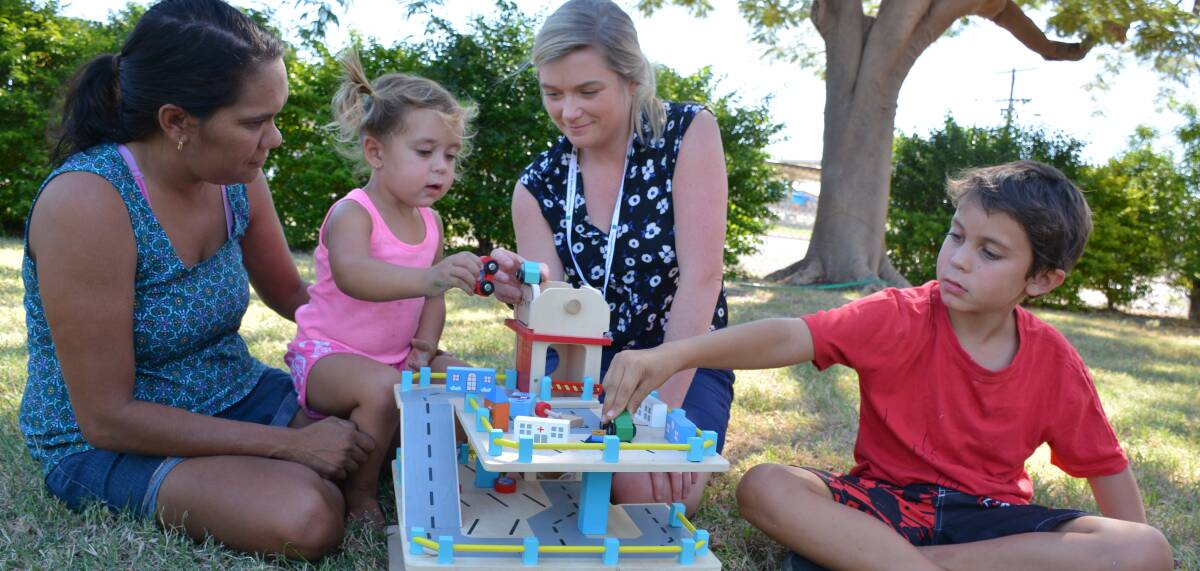 PLAY TIME: Playgroup Queensland's Tanya Gould plays with Lucy Gould, 23 months, Centacare's Jo Frame, and Shaun Gould, 7. Photo: Chris Burns. 