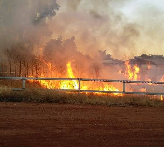 FLARING UP: A fire that started near the Mount Isa racecourse last Wednesday evening. Photo: Facebook. 