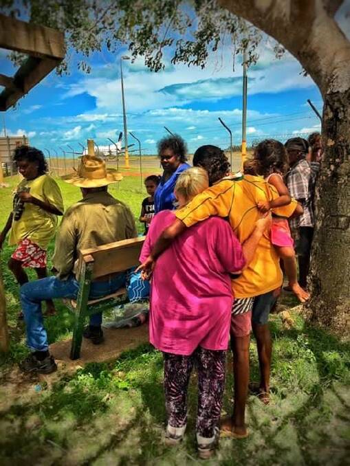 Mornington Island locals wait at their airport. It's the only commercial way on and off the indigenous gulf community and is therefore significant for access, medical treatment and supplies. Photo: Steve Hodder Watt. 