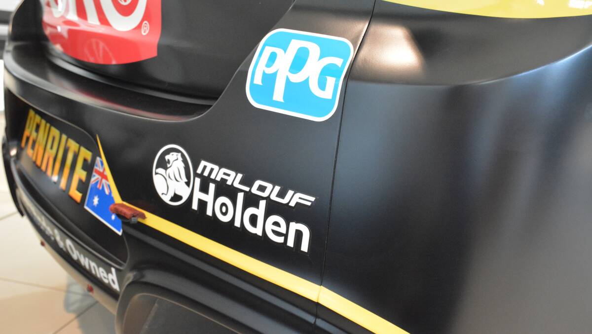Malouf Holden's brand on the back of Reynold's race car. 