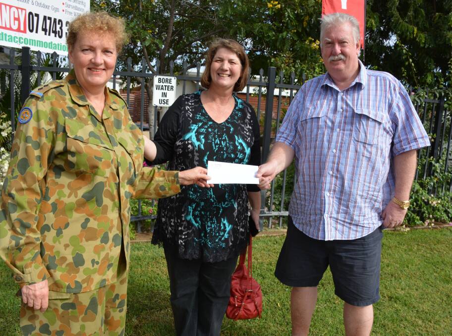 CHEQUE PRESENTATION: Janette Pilz, from the 143 Army Cadet Unit, and cadet parent Kerry Bower present Leichhardt Accommodation owner Glen Ashmore with the raffle prize money he won. Photo: Chris Burns. 