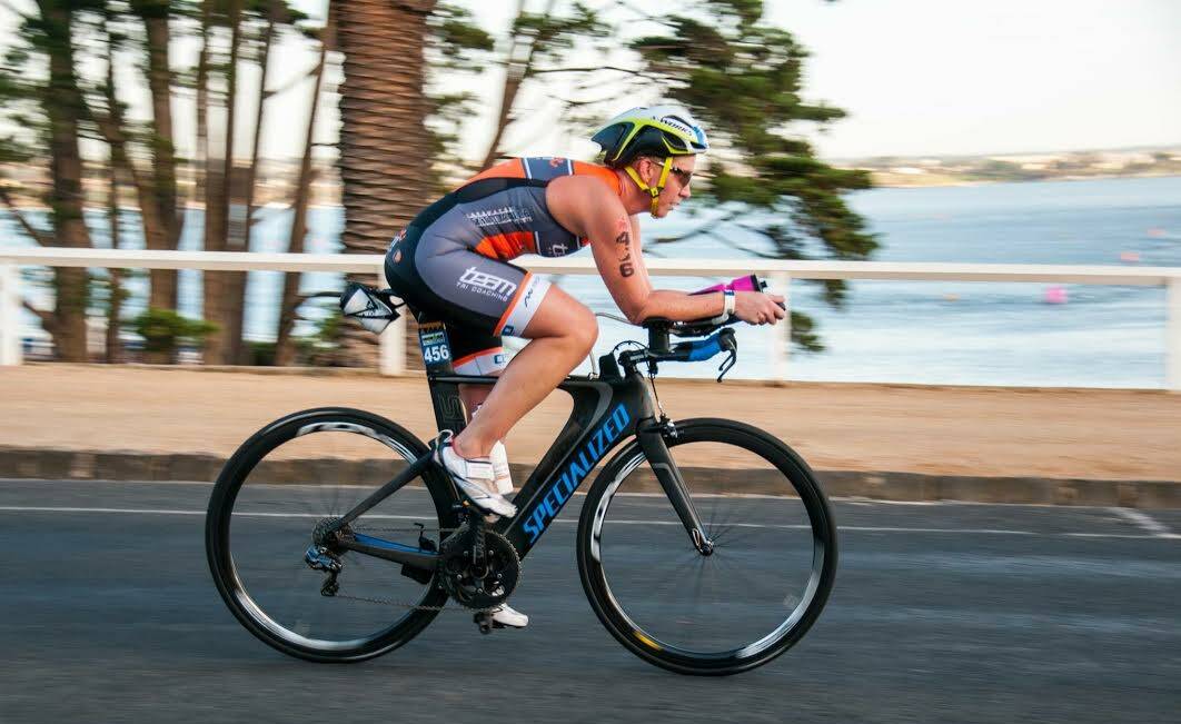 Pushing on: Amanda Gowing rides in the 90 kilometre cycling leg in the Geelong half Ironman. The wind direction was unpredictable. Photo: @ready.salted.images. 