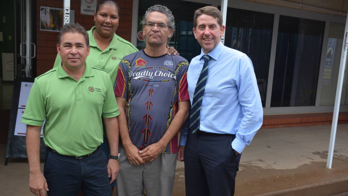ANNOUNCEMENT: Gidgee Healing chief executive Dallas Leon, Mums and Bubs health worker Melissa Eggmolesse, and chairman Shaun Solomon hear of Health Minister Cameron's Dick's funding announcement for a new clinic. Photo: Chris Burns. 