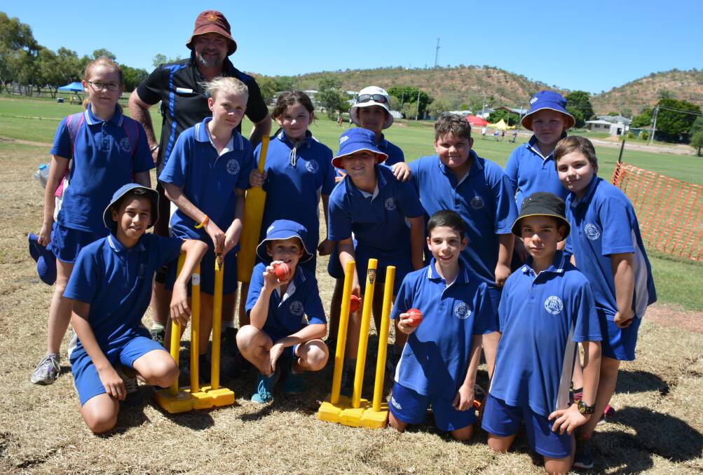 VICTORY: The Happy Valley State School cricket team and principal Norm McNamara grab a team photo shortly after winning the local T20 Blast grand final. Photo: Chris Burns. 